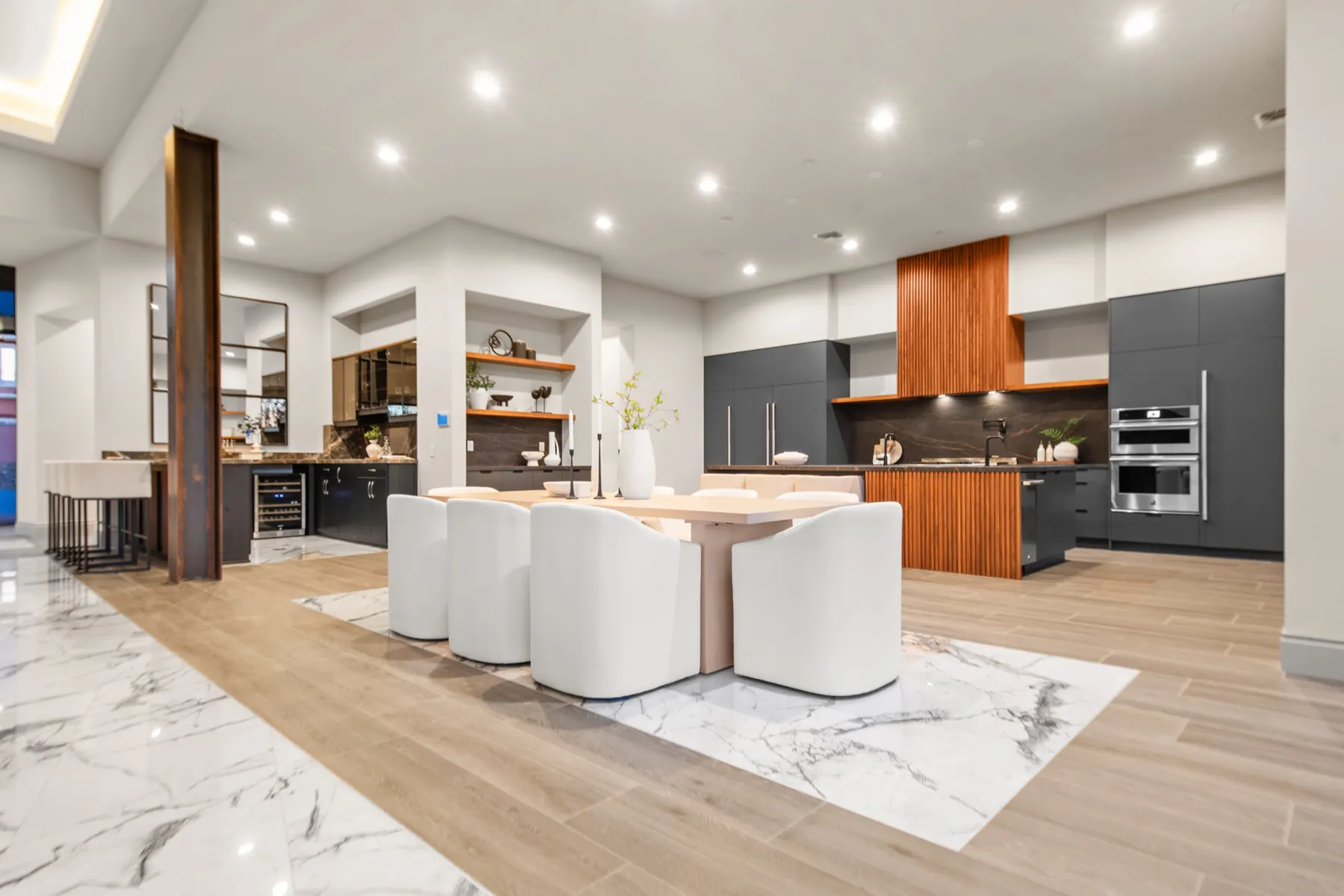 A staged modern kitchen with a marble island
